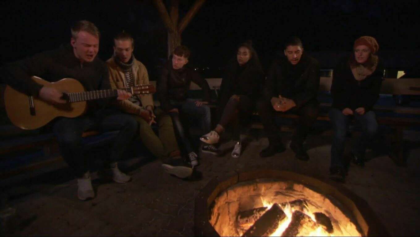 Singing together around the campfire
